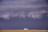 Close view of the bottom of a shelf cloud with scud teeth