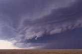 The layers of a shelf cloud step downward as gust front approaches