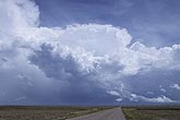 As a flat anvil top emerges from lower clouds, a storm is born