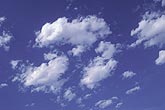 Free-floating puffy clouds play energetically