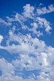 Erratic cloud tufts create a joyous cloudscape
