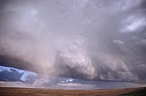 The back of a flanking line axis in an evolving storm cloud line