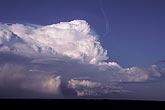 This heap of clouds is a thunderhead shining brightly in the sunlight