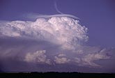 Overview of a boiling thunderhead with Pileus in early evening light