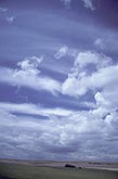 Serene scene of smooth and soft puffy clouds in a changing sky