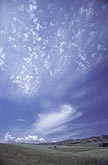 Silvery clouds spread joy in a skyscape